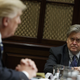 White House Chief Strategist Steve Bannon listens at right as President Donald Trump speaks during a meeting on cyber security in the Roosevelt Room of the White House in Washington, Tuesday, Jan. 31, 2017.